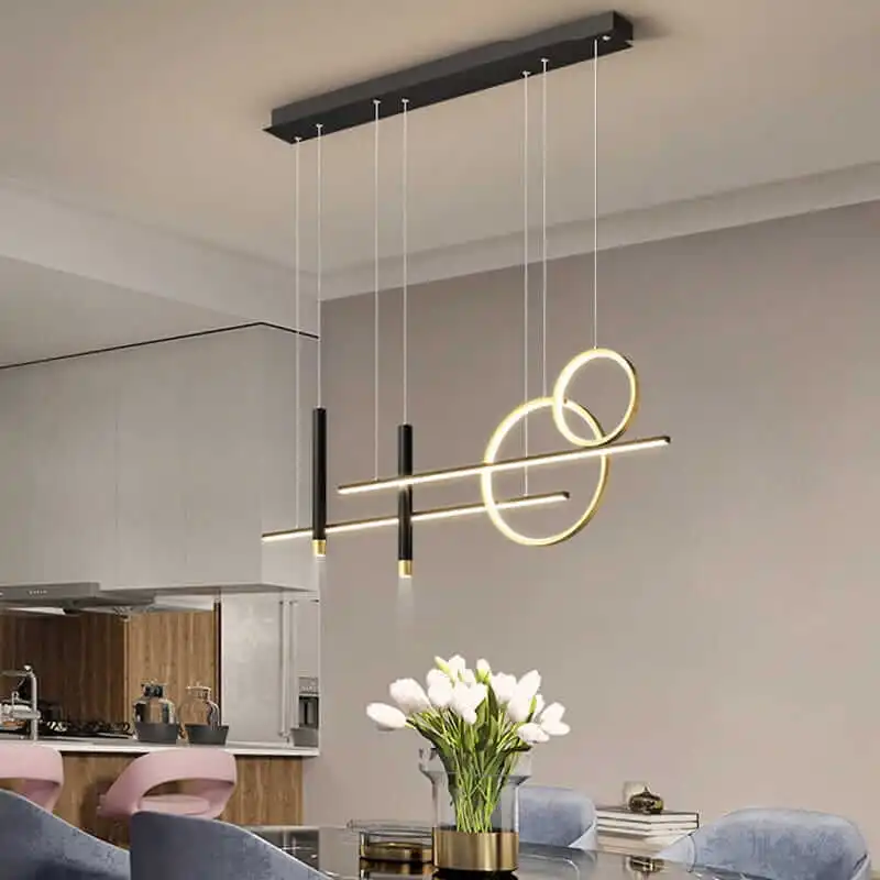 Lampa-wiszaca-LED-regulowana-barwa-oswietlenie-stolu-w-salonie-jadalni-Axis-czarno-zlota-aranzacja.webp