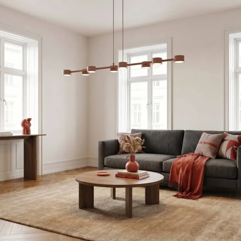 Długa-lampa-wisząca-w-kolorze-różowym-w-salonie-w-stylu-industrialnym-Megara-8-Coral.webp